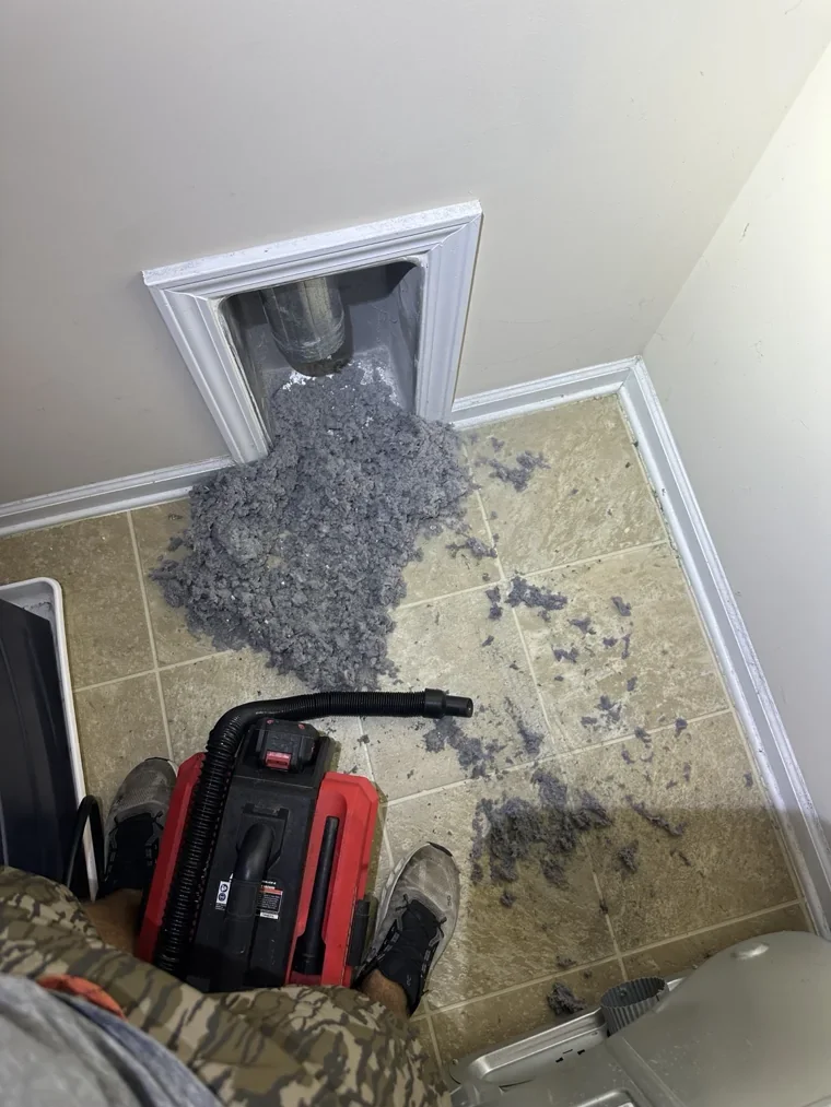 Lint removed from a dryer vent connection during cleaning