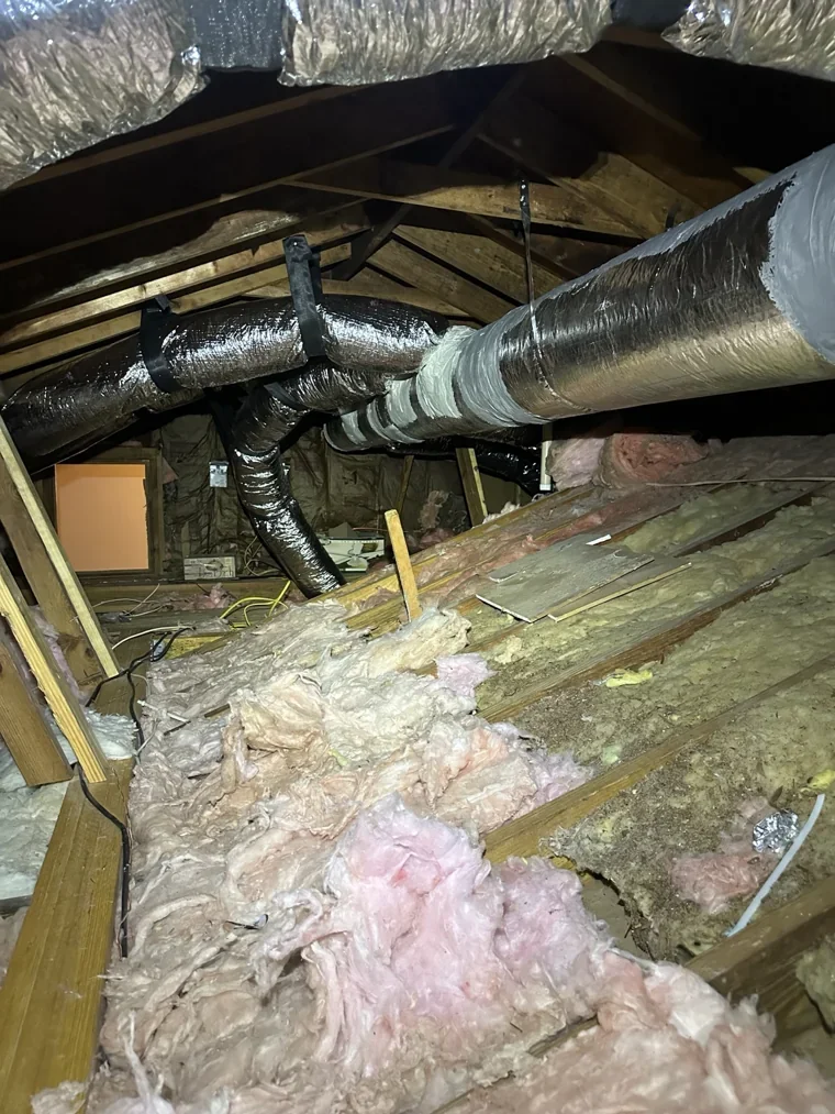 Insulated ductwork routed through an attic