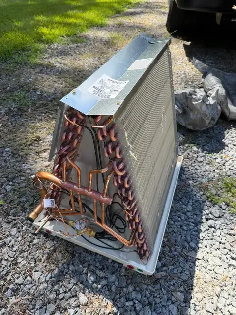 Evaporator coil with visible copper tubing before installation