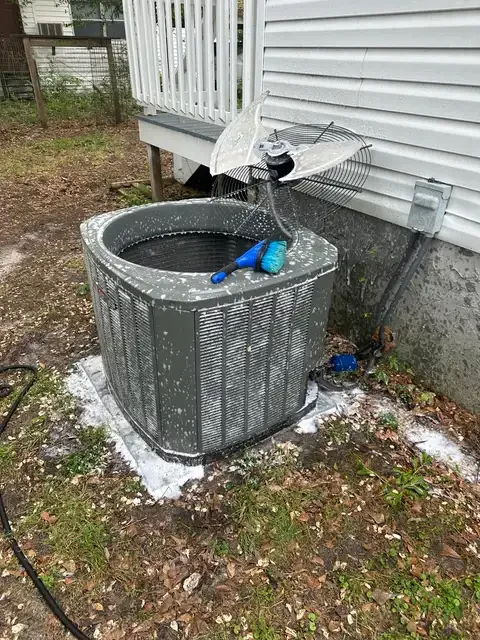 Outdoor HVAC unit with the fan assembly removed during cleaning