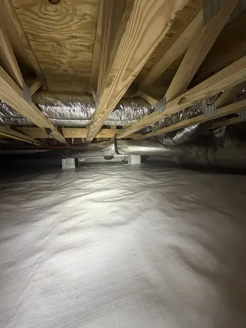 Crawlspace ground liner, wrapped piers, and insulated ductwork