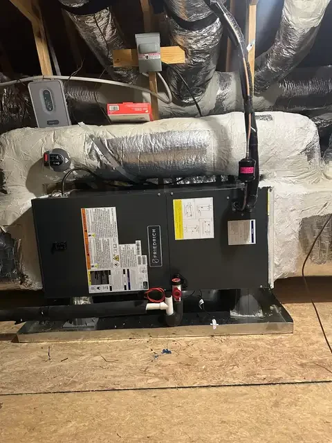 Horizontal air handler with insulated duct connections in an attic