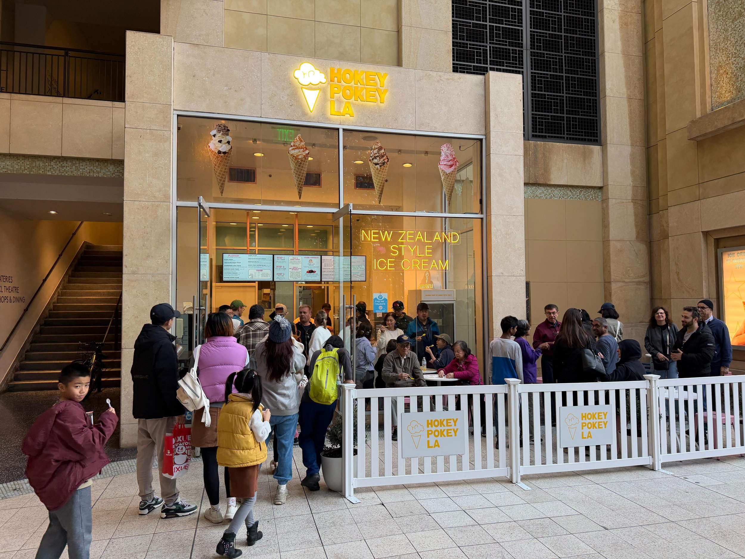 The Hokey Pokey LA storefront at Ovation Hollywood, with a queue outside under the yellow sign.