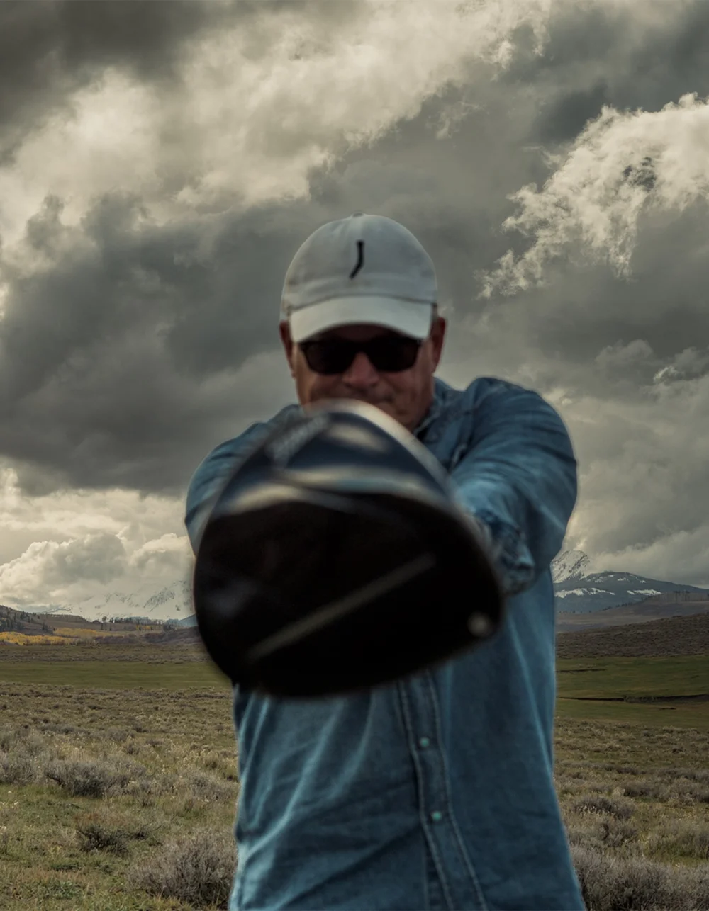 A golfer presents the driver toward the camera.