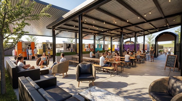 Orchards Station covered lounge and dining area with food carts beyond