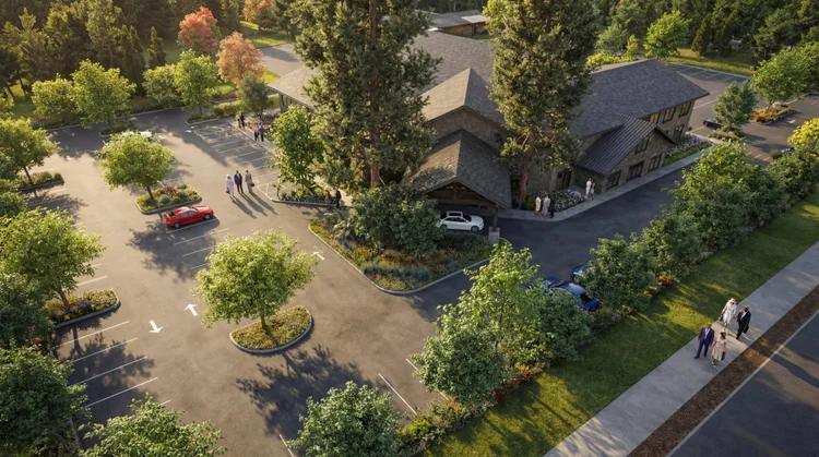 Aerial view of Brush Prairie Church with tree-lined parking and the covered drop-off