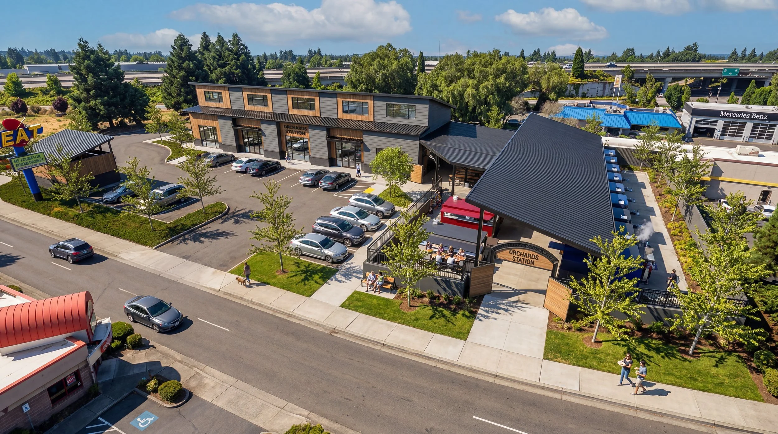 Aerial view of the Orchards Station site with its buildings, covered food hall and parking