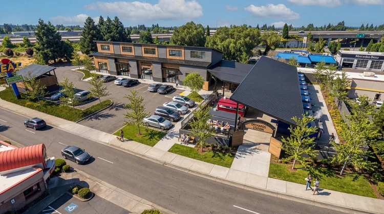 Aerial view of the Orchards Station site with its buildings, covered food hall and parking