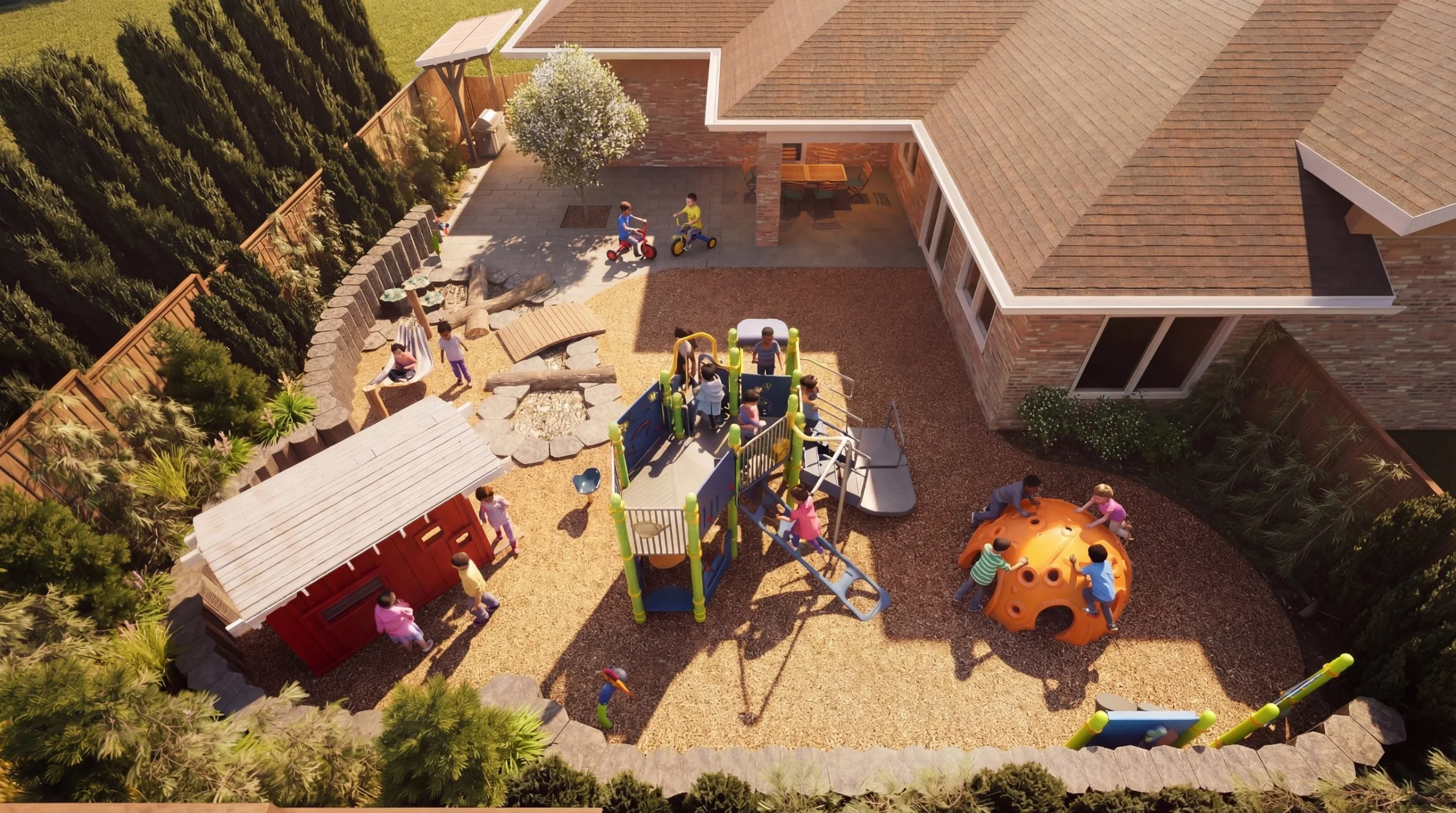 Aerial view of the Ronald McDonald House play yard with a play structure, climbing dome, playhouse and patio