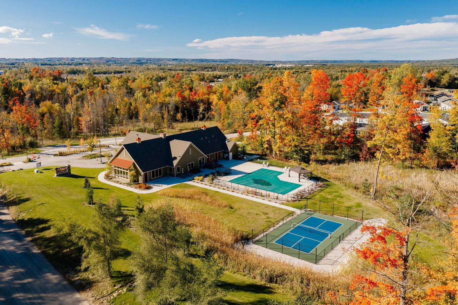 Aerial of the Alta Vista Lodge, pool and pickleball court in fall