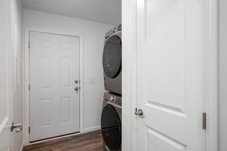 Laundry with a stacked washer and dryer