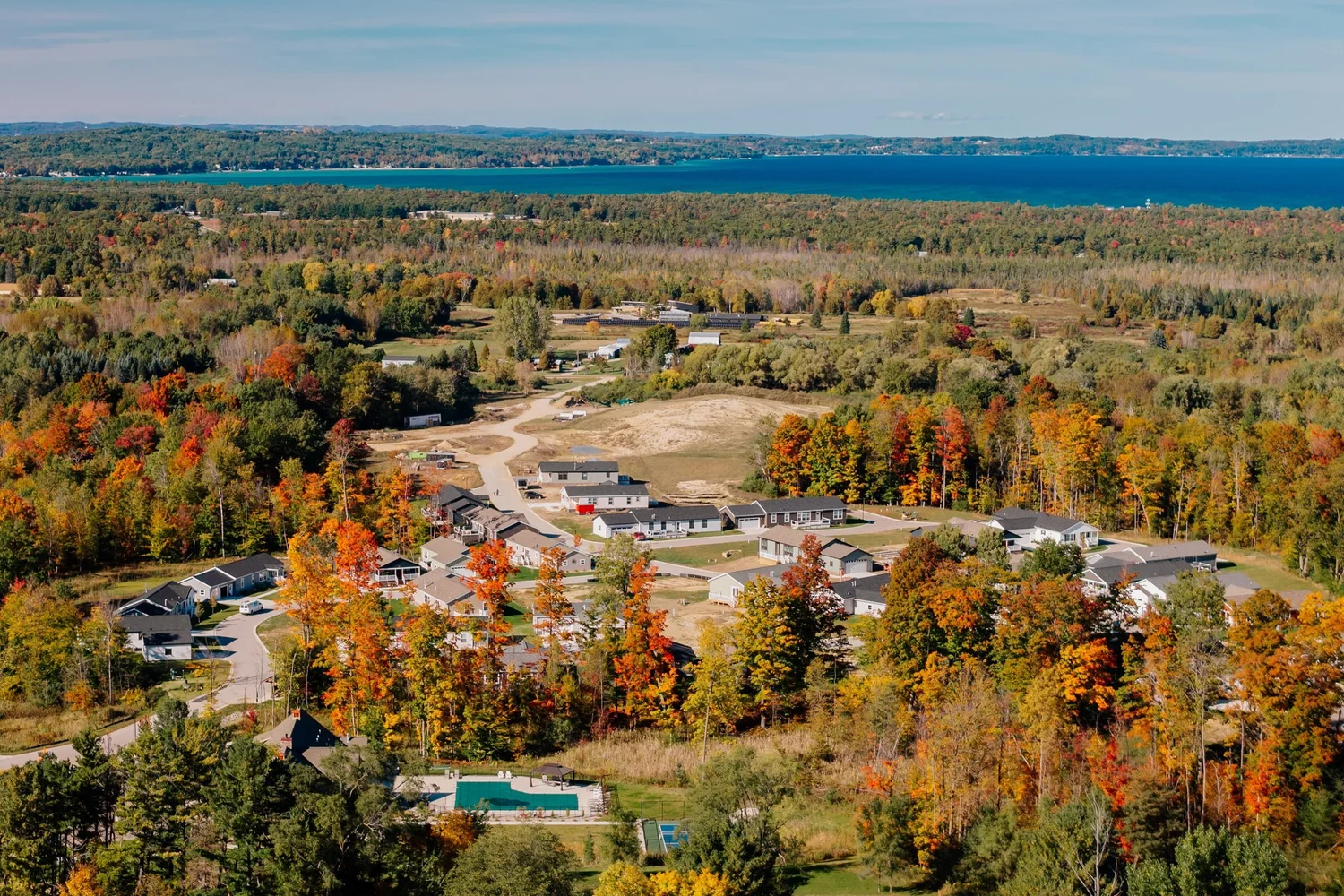 Aerial view over East Bay Township toward Grand Traverse Bay in fall