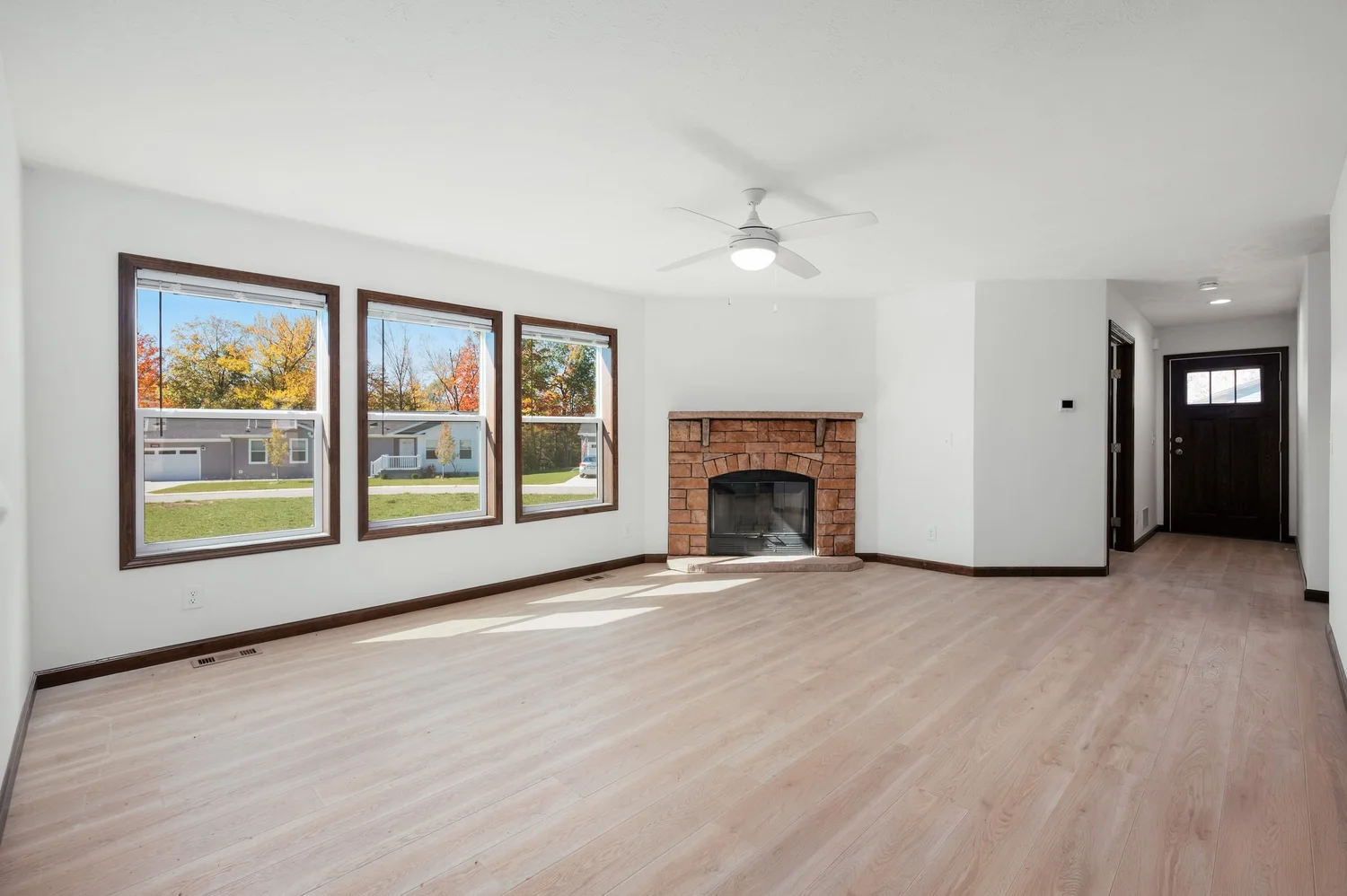 Living room with a wood-burning brick fireplace