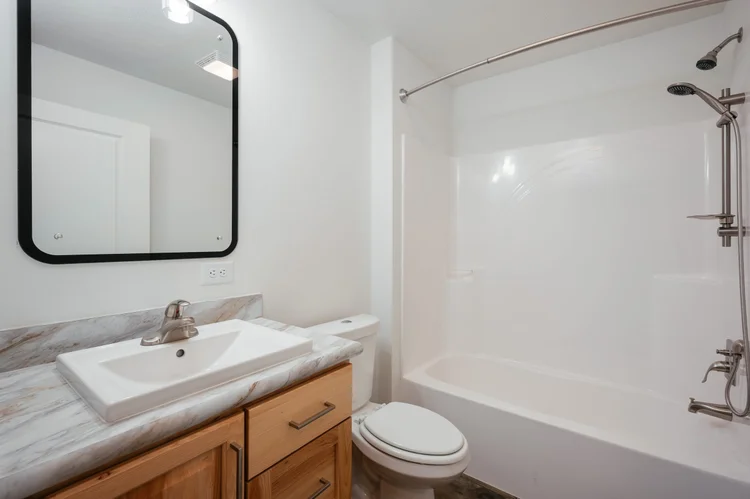 Second bathroom with a tub and shower