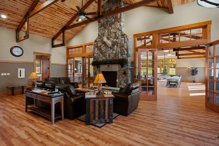 Lodge great room with a fieldstone fireplace