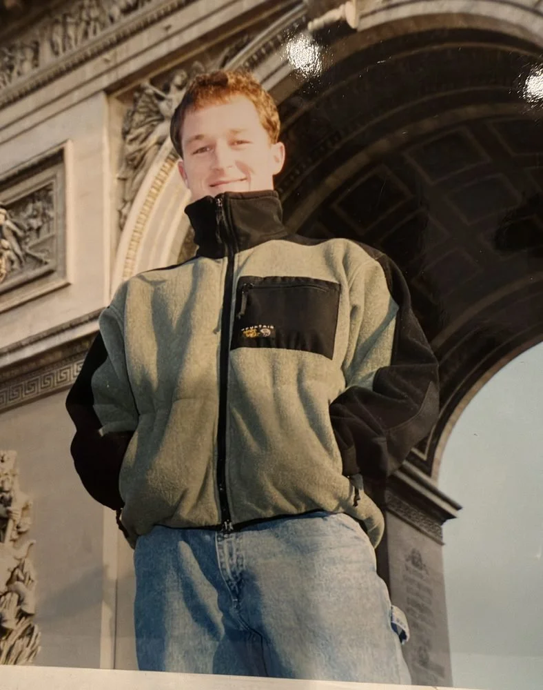 Mike in a grey and black Mountain Hardwear fleece at the Arc de Triomphe