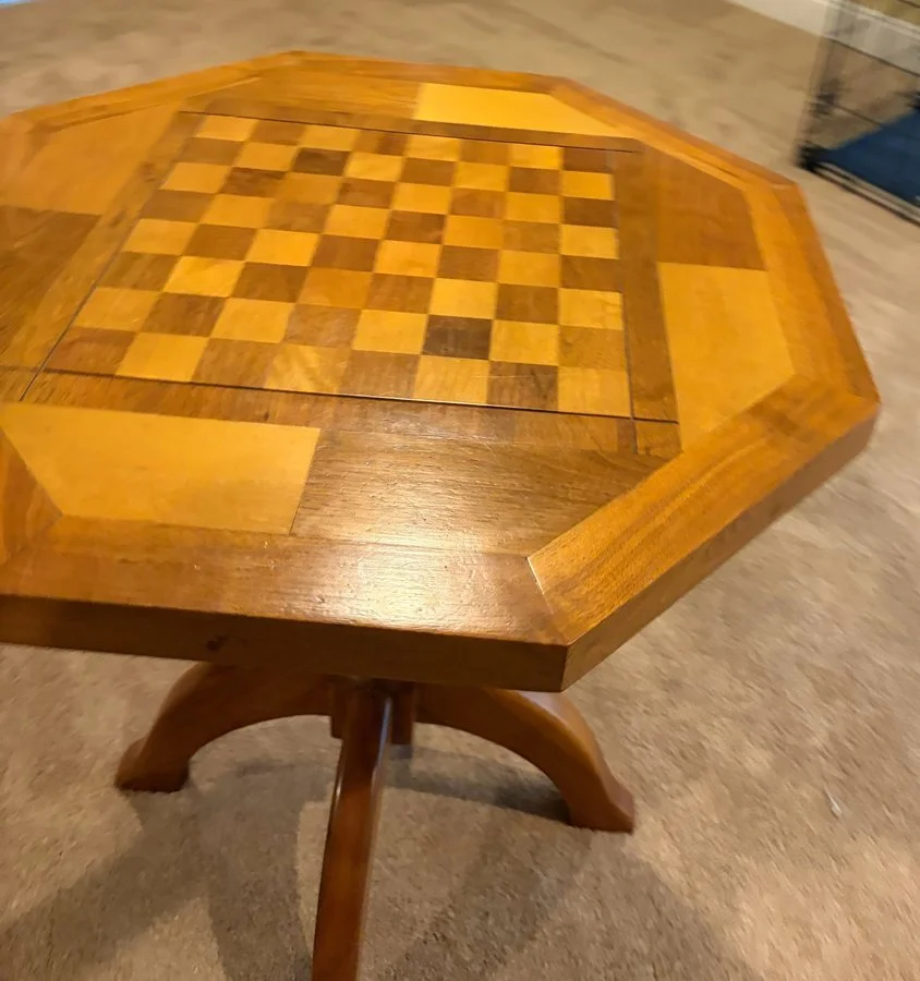 Grandpa Jack's octagonal wooden table with an inlaid checkerboard