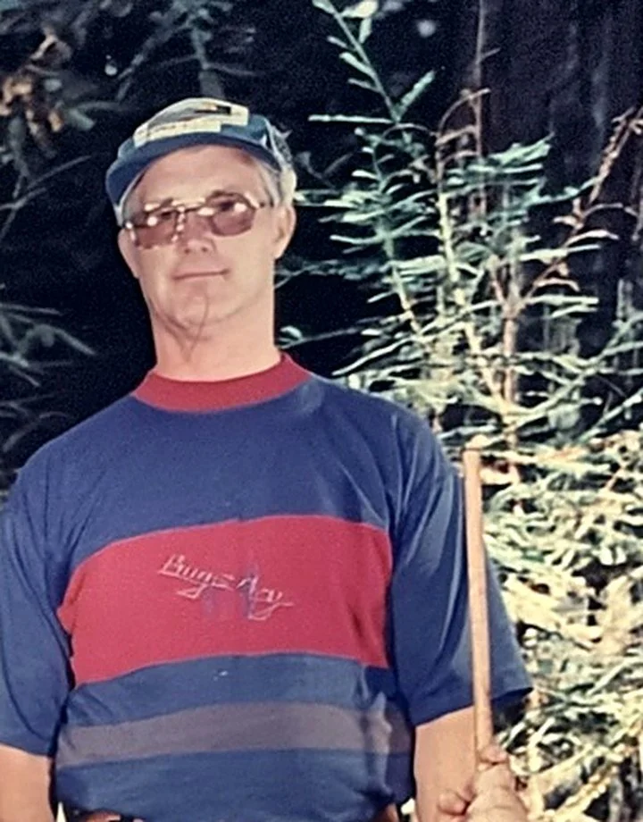 Mike's dad as a Scout leader in the redwoods at Camp Royaneh, in a cap and striped shirt