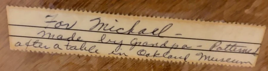 Handwritten label: For Michael, made by Grandpa, patterned after a table in Oakland Museum