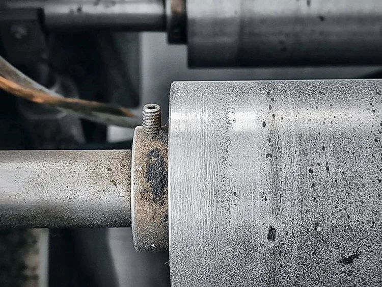 Close-up of a conveyor roller and shaft