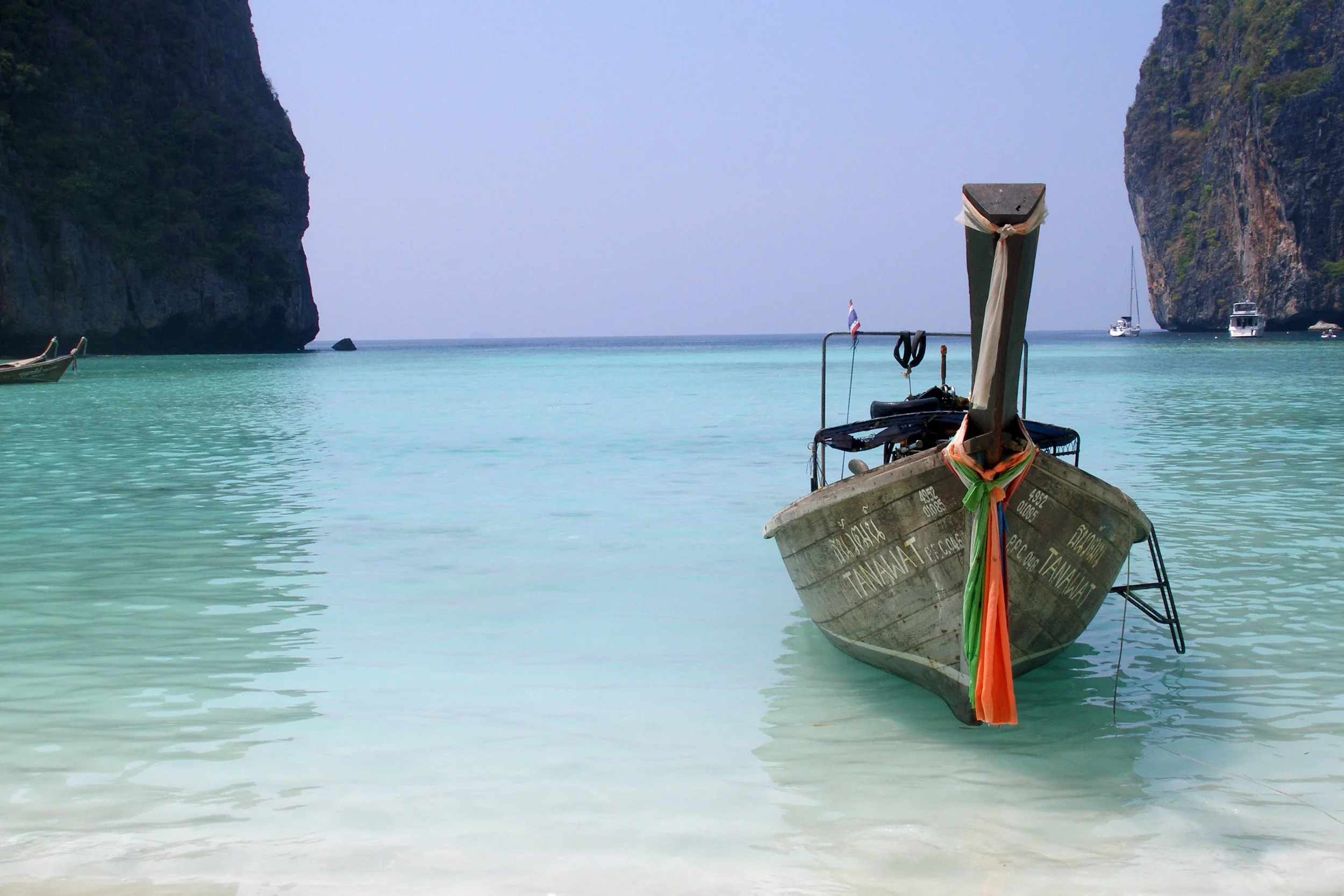 A longtail boat in the turquoise water of Maya Bay, Thailand