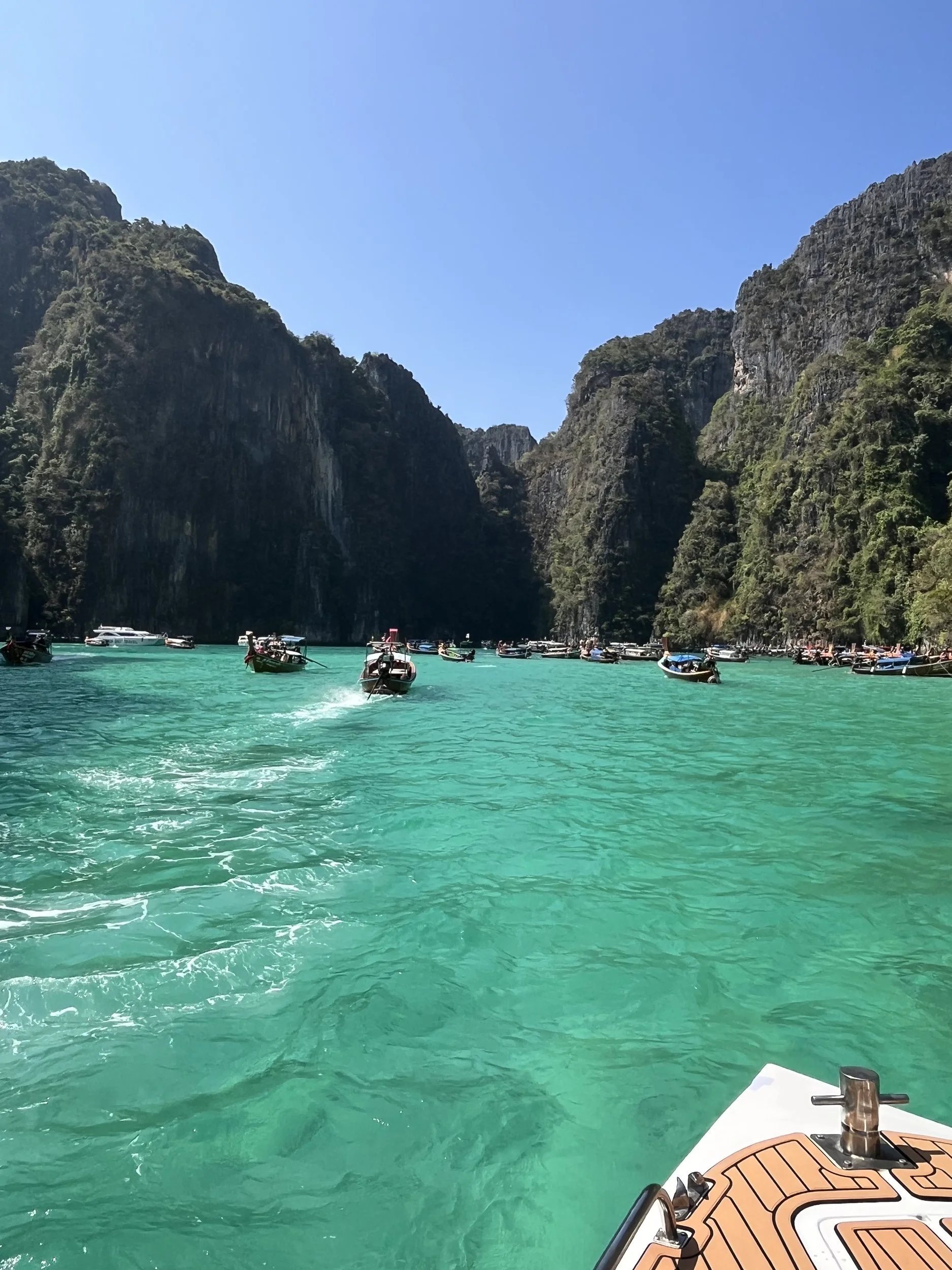 An emerald lagoon framed by limestone cliffs in Phi Phi