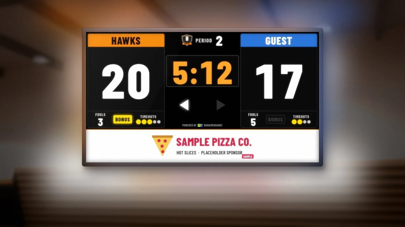 Concept rendering of a full-color LED video scoreboard on a high school gym wall, showing a sample Hometown Hawks 20 to 17 basketball game with a sponsor zone along the bottom