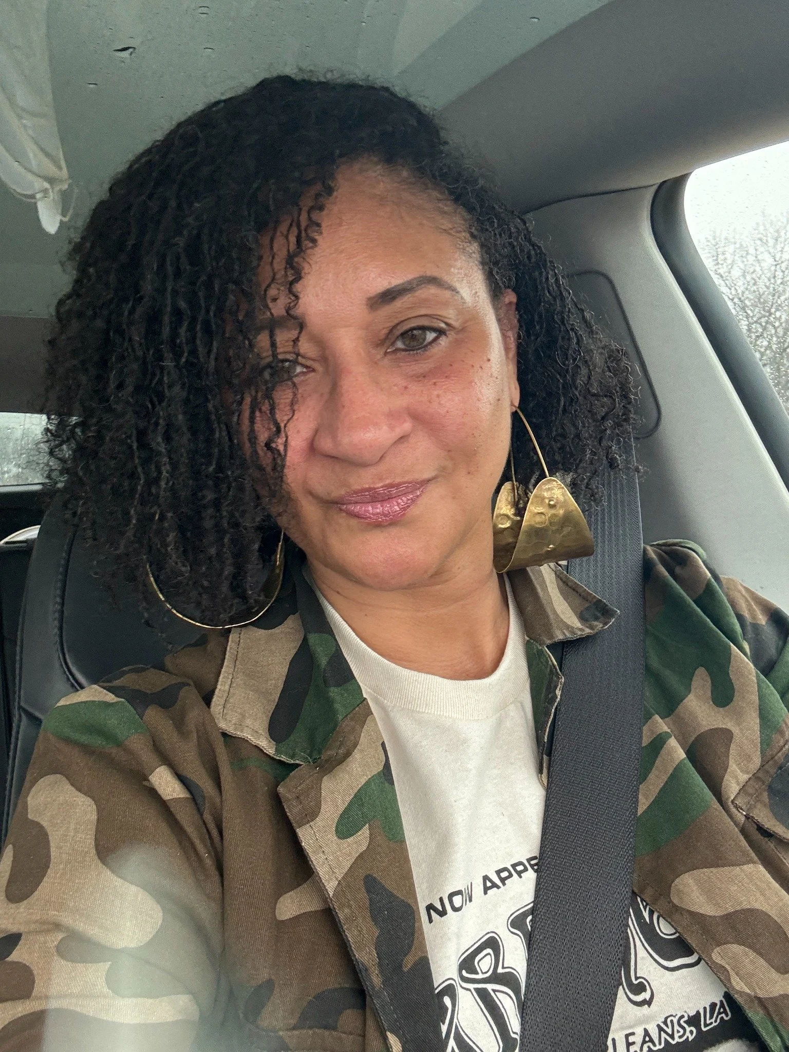 Nisha wearing a camouflage jacket