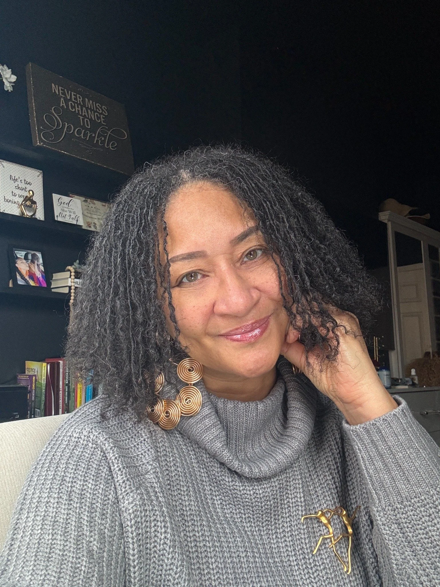Nisha McNair in a gray sweater