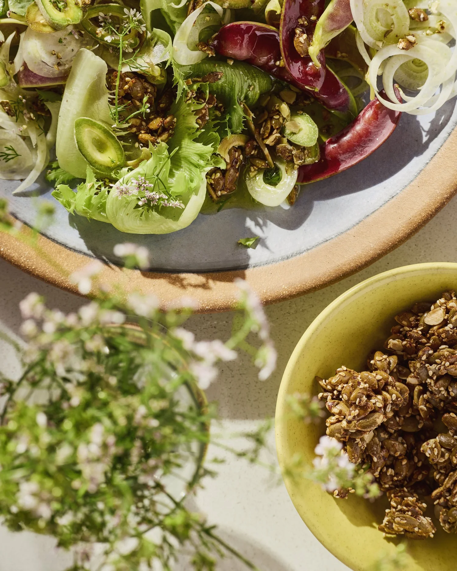 Seasonal greens salad with seed clusters
