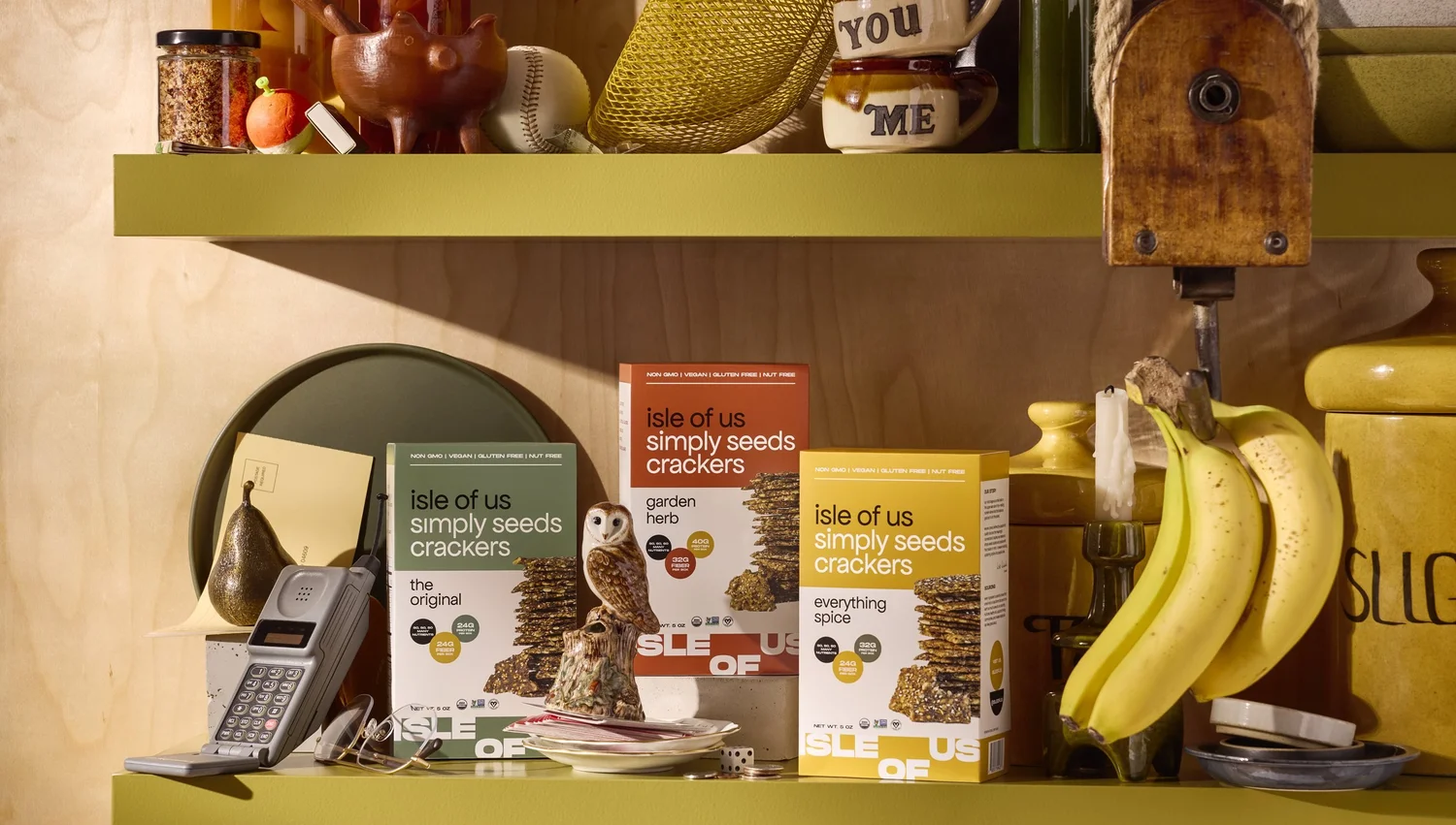 Isle of Us cracker boxes on olive shelves