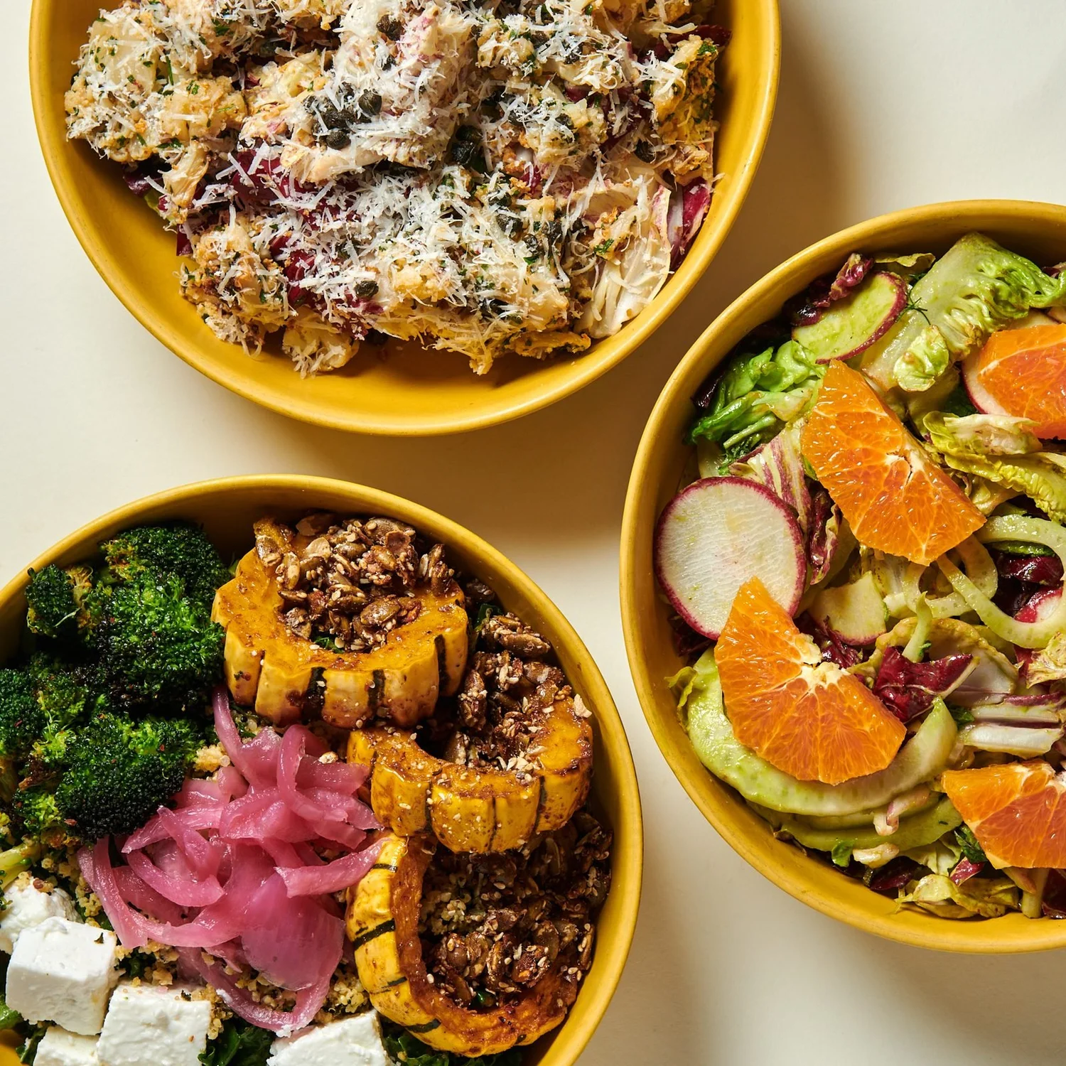 Individual bowls: fall harvest, citrus and fennel salad, and a roasted cauliflower salad