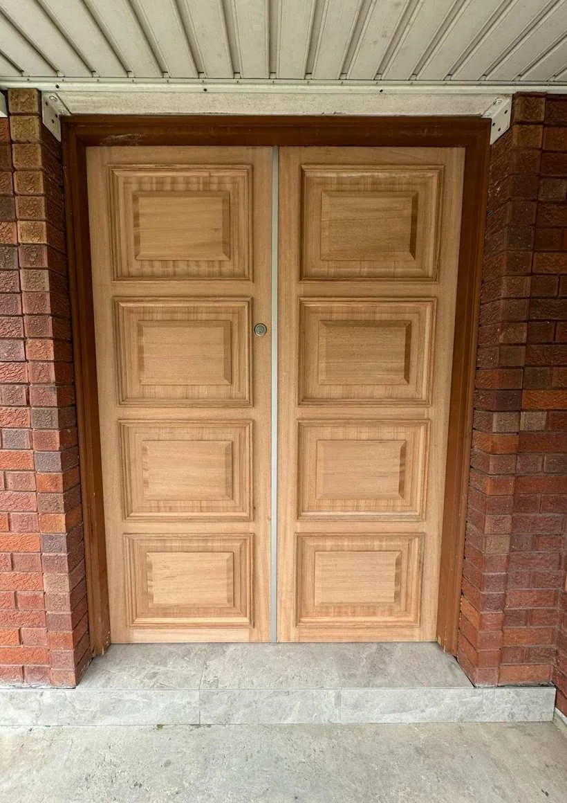 Double raised-panel timber entry doors
