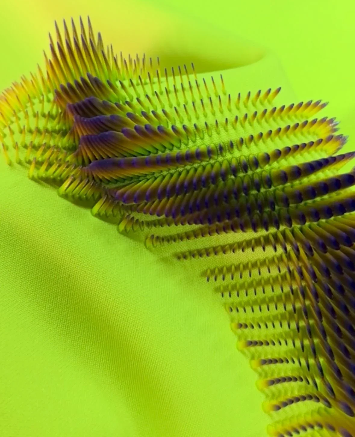 Raised multicolour 3D printed structures on vibrant lime fabric