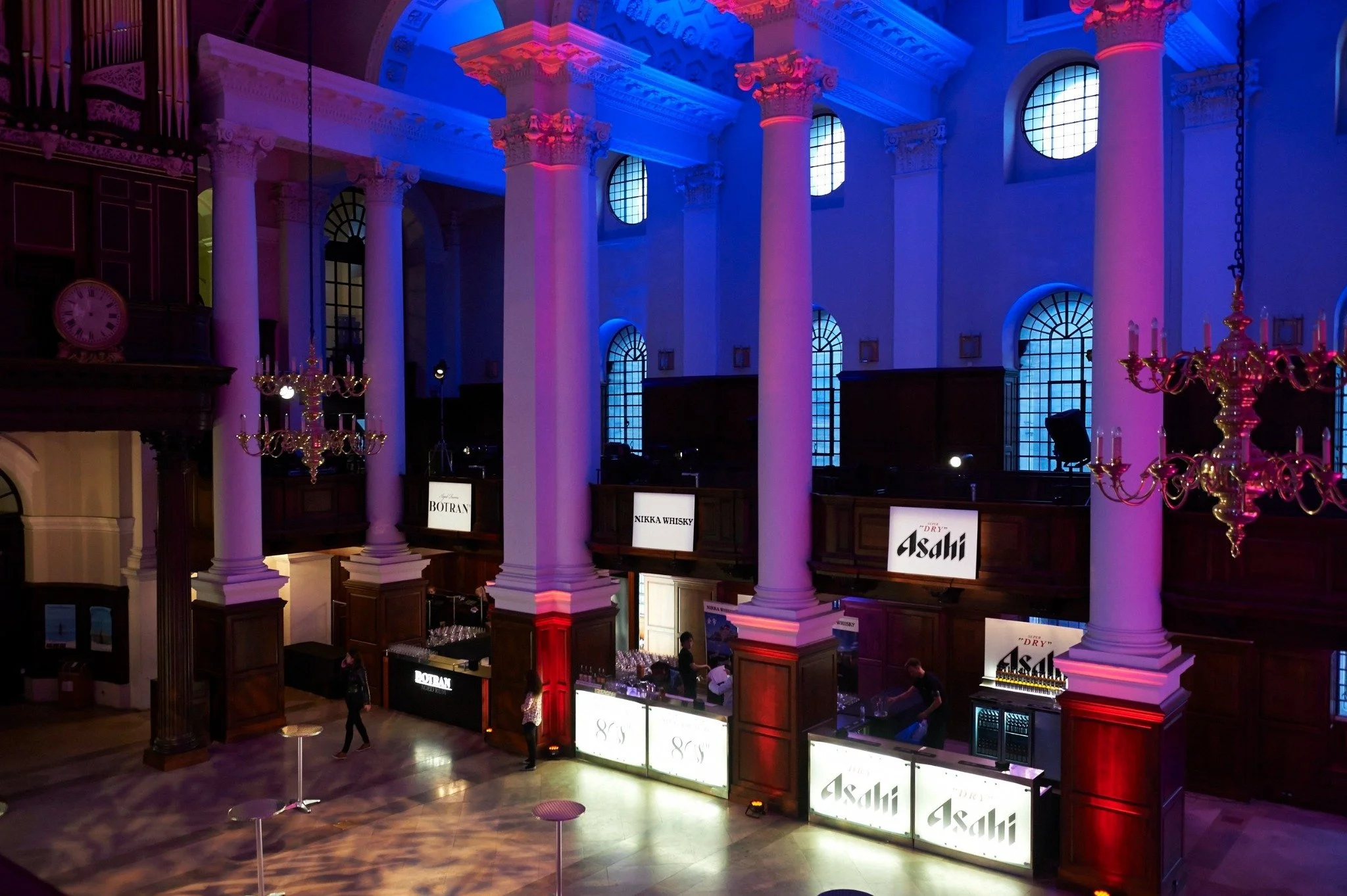 Illuminated branded drinks installations beneath the Nave’s columns and chandeliers