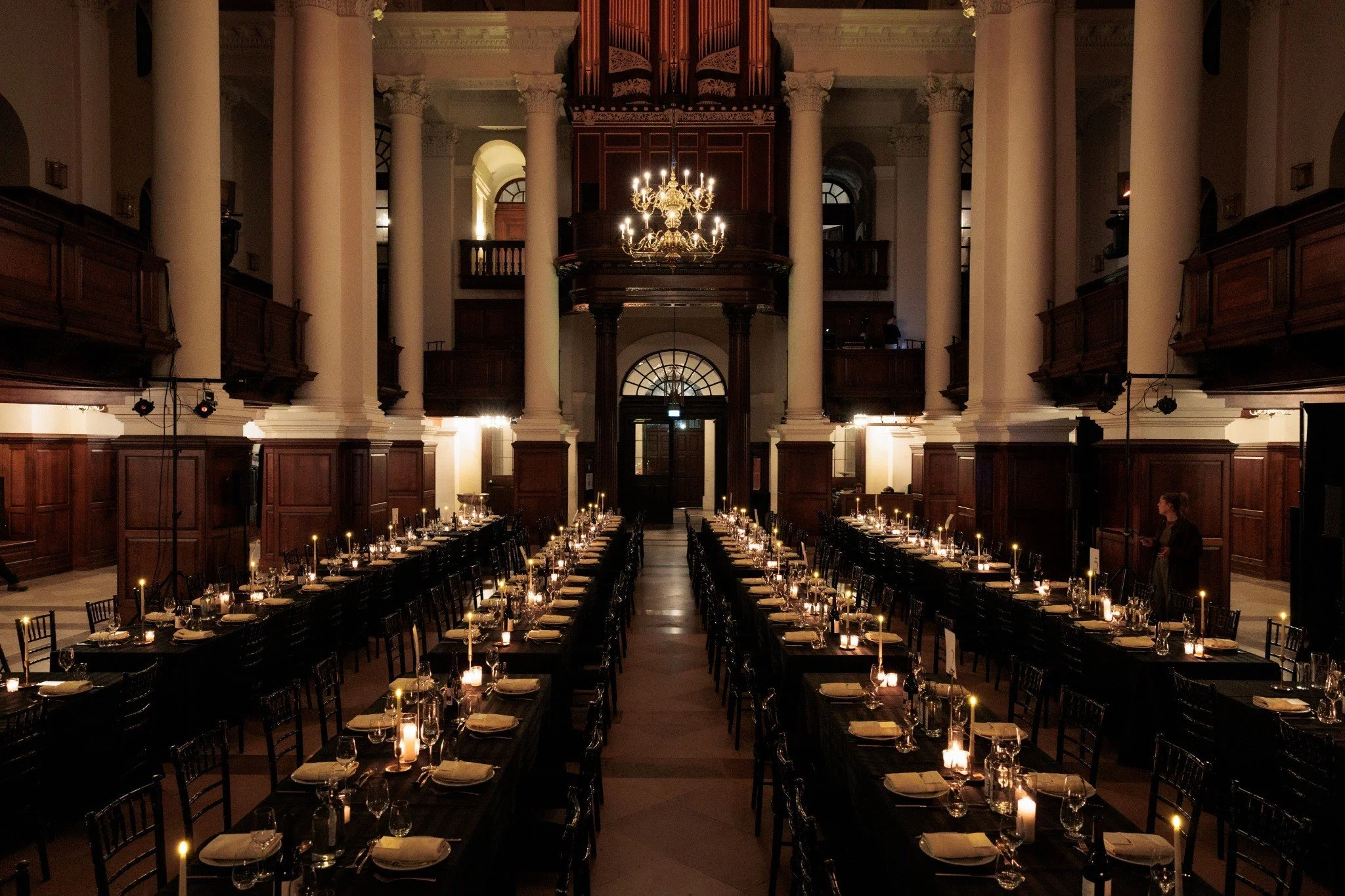 Candlelit dinner tables in the Nave