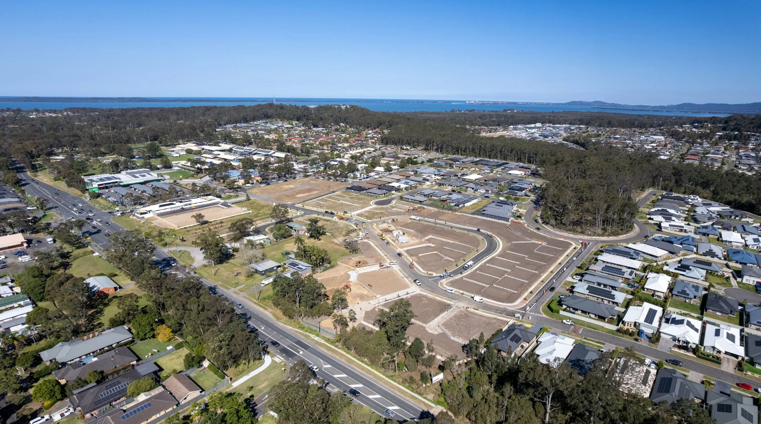 Aerial view of Wadalba Central with Tuggerah Lake and the ocean in the background