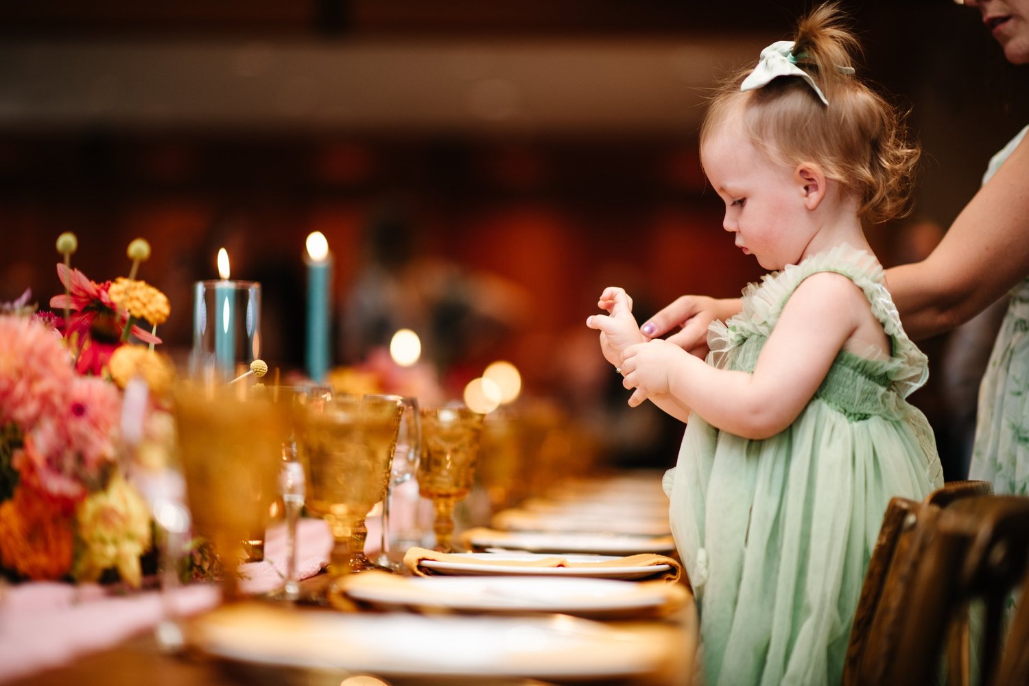 A little one exploring the tables