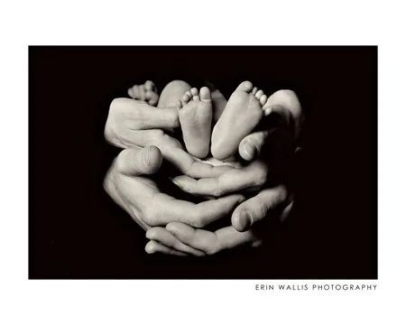 baby feet and parents hands