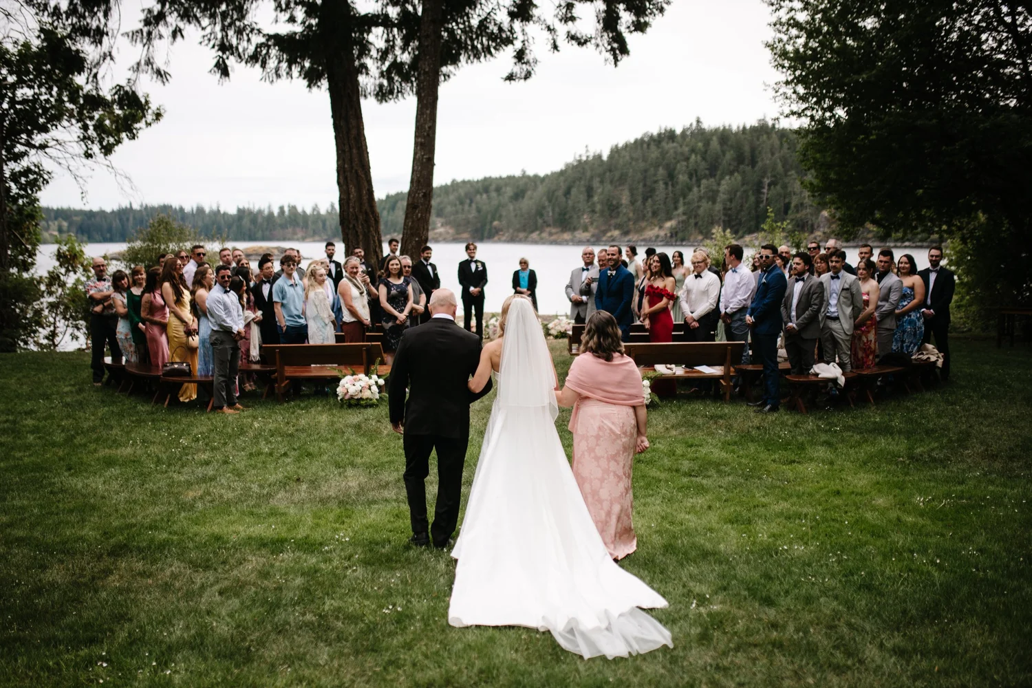 Megan walked down the aisle toward Devon by the water