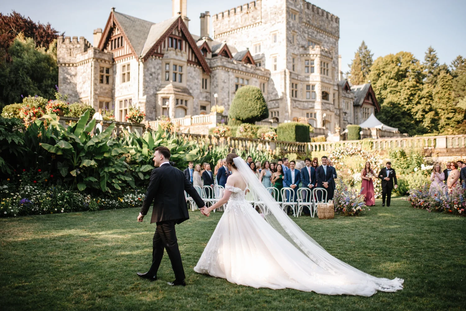 Guests cheering as the couple pass