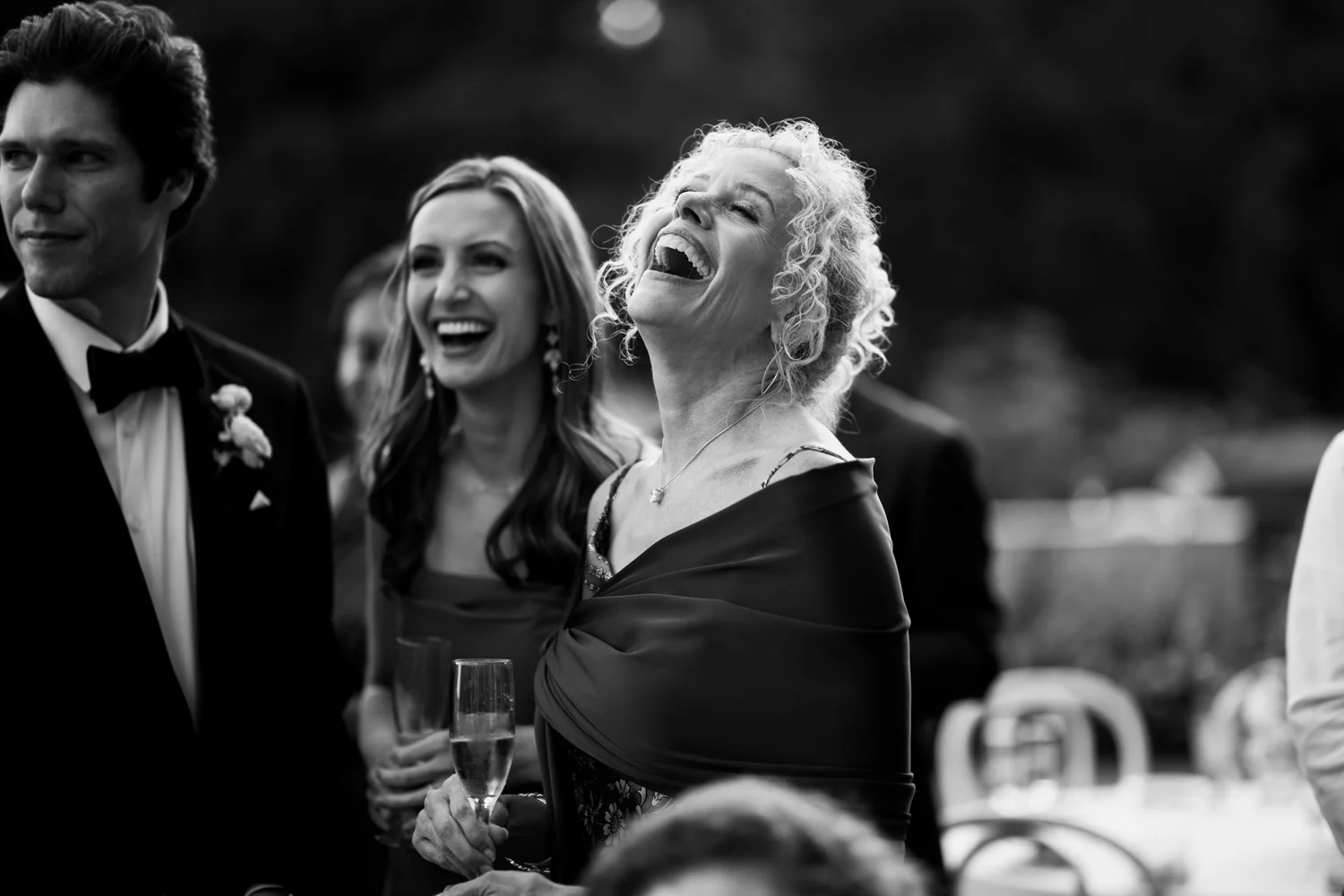 A guest laughing during speeches