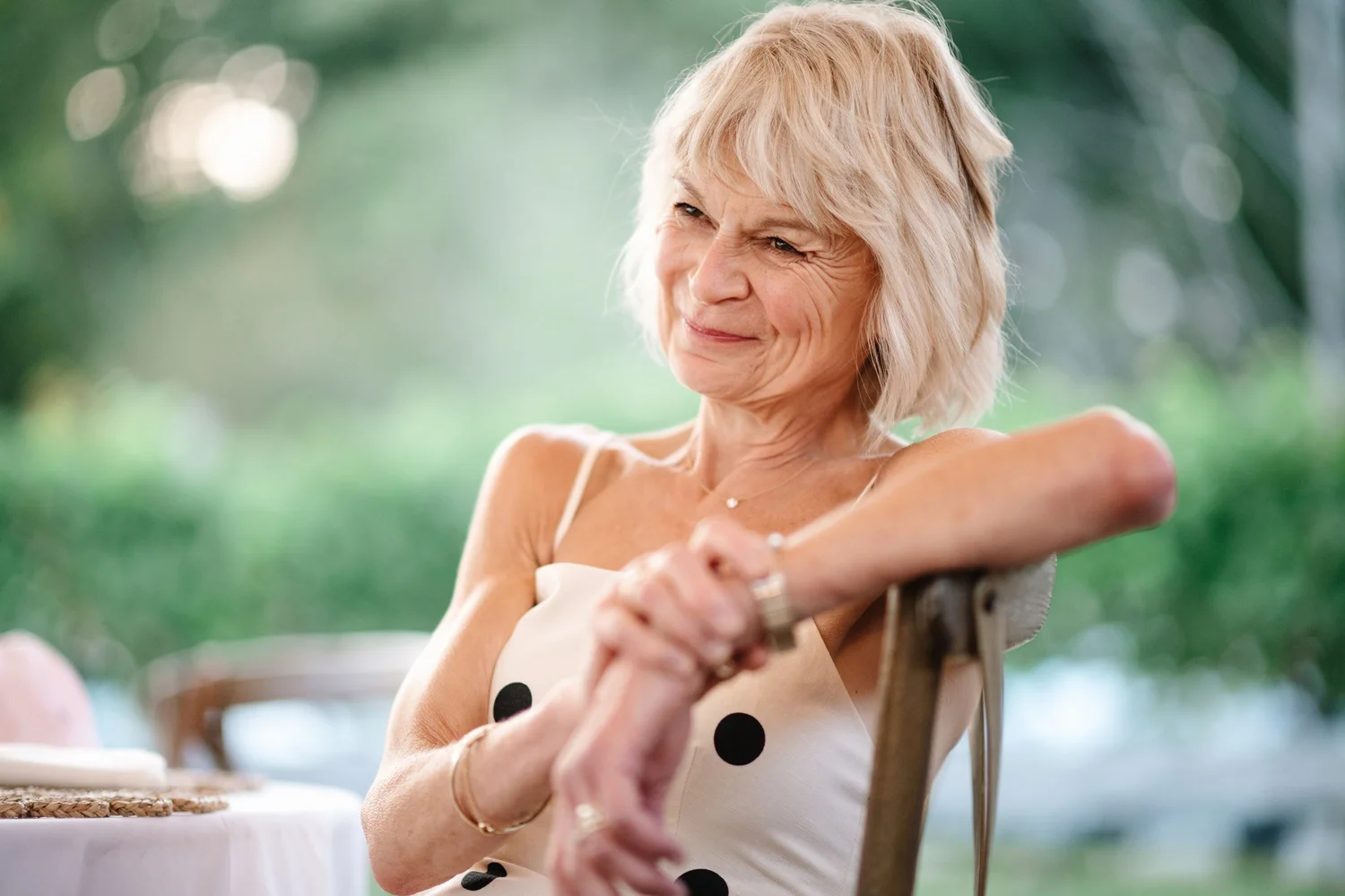 A guest smiling in the summer light
