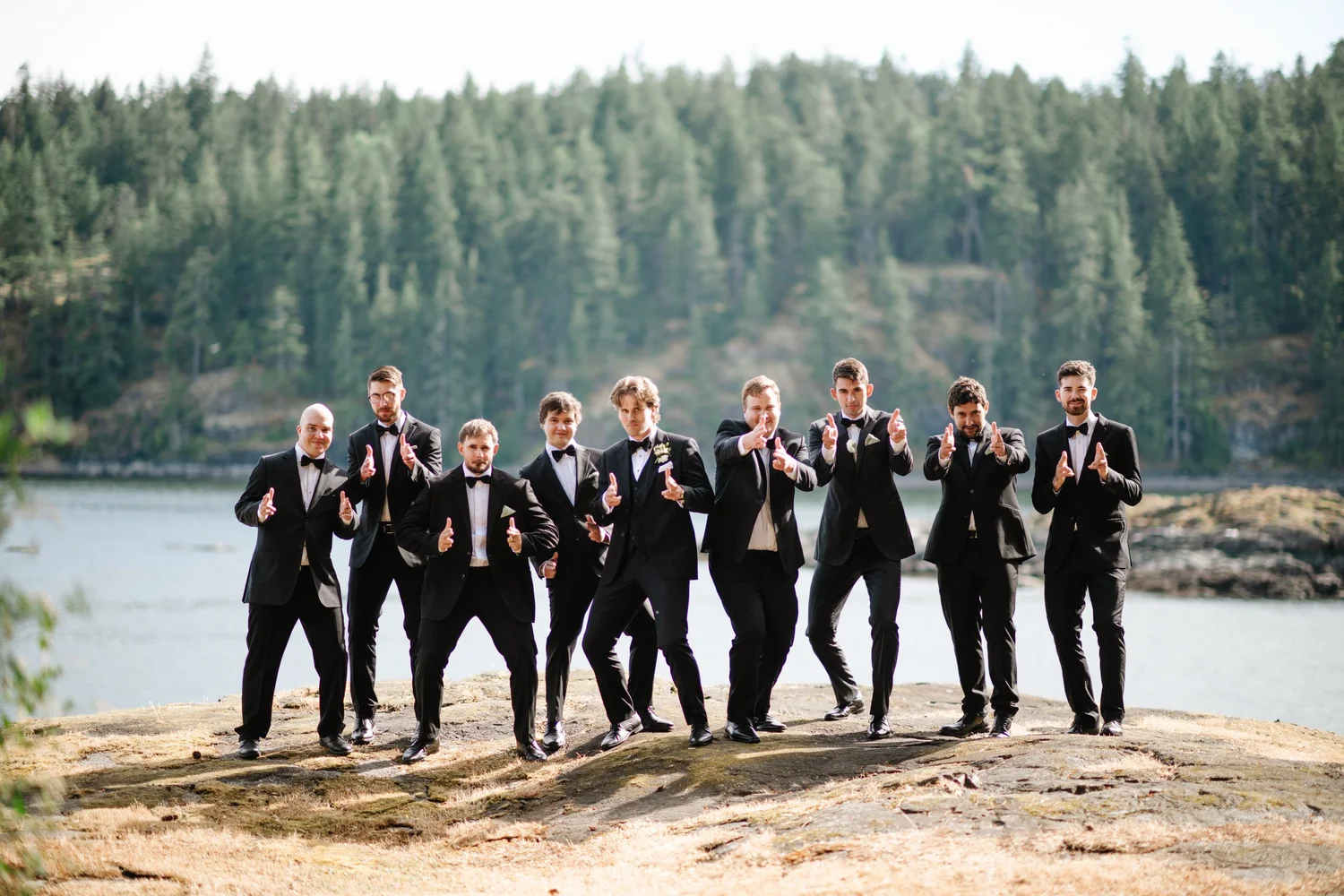 Devon with his groomsmen on the beach