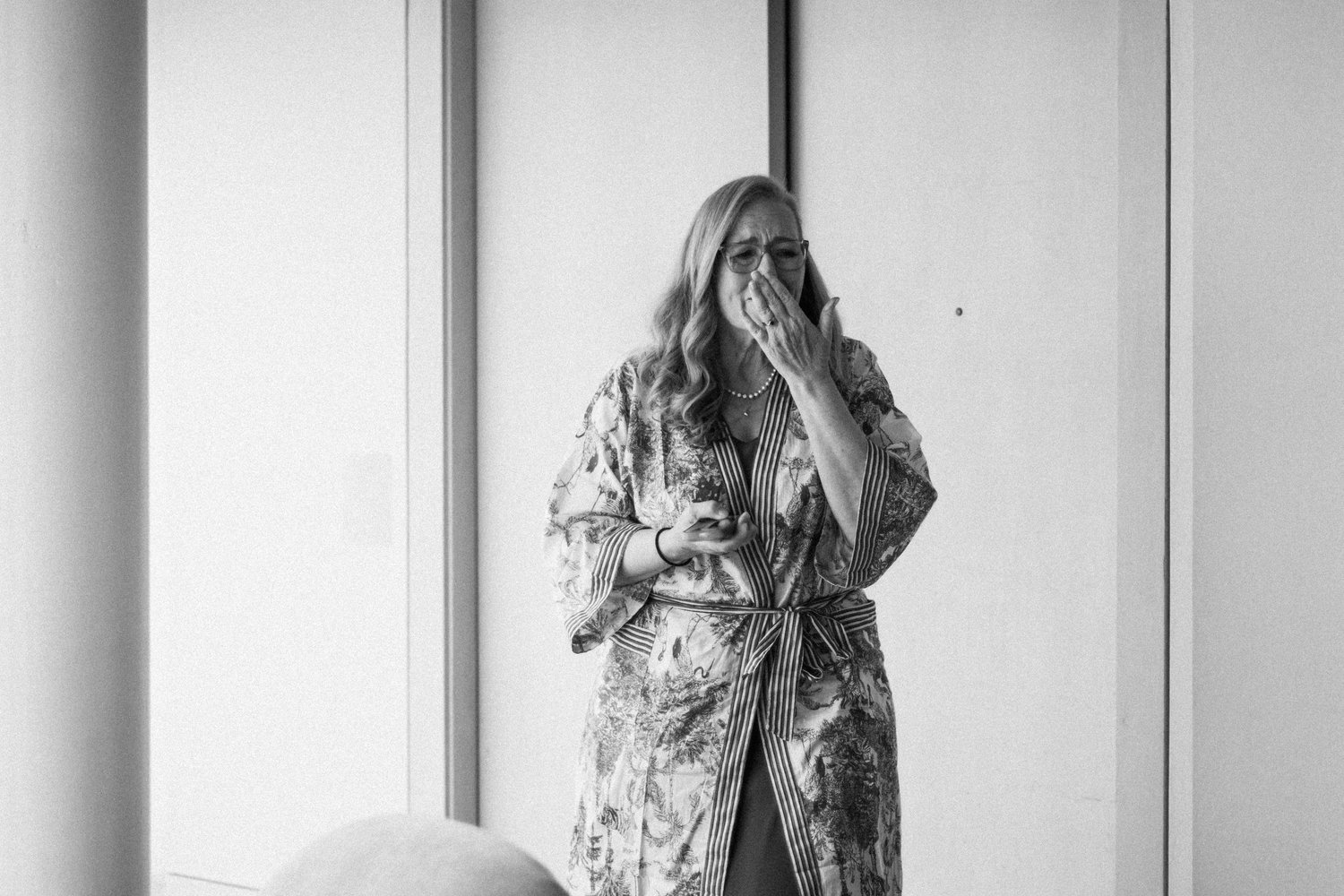 The bride getting ready, in black and white