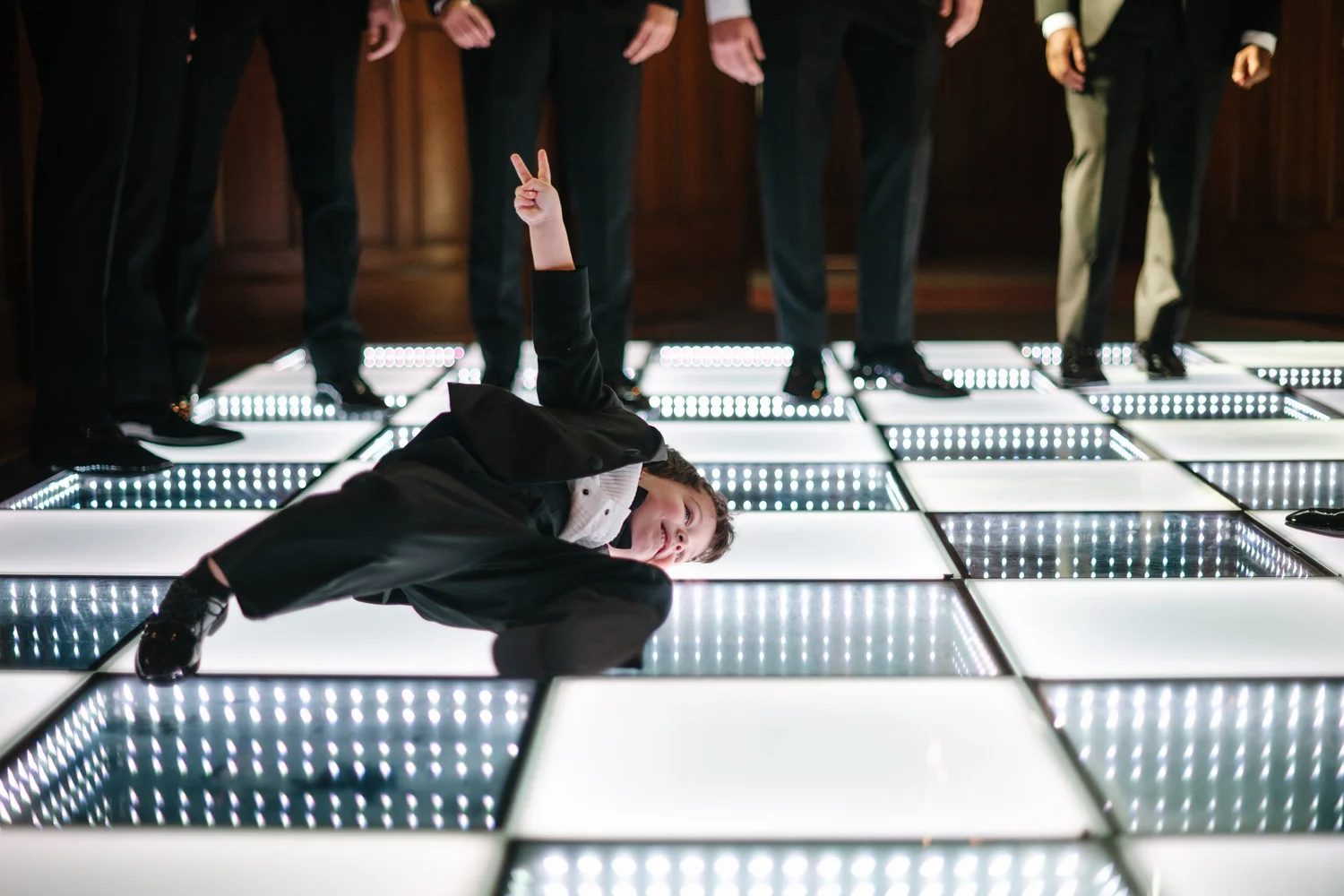 A guest dancing on the light up floor