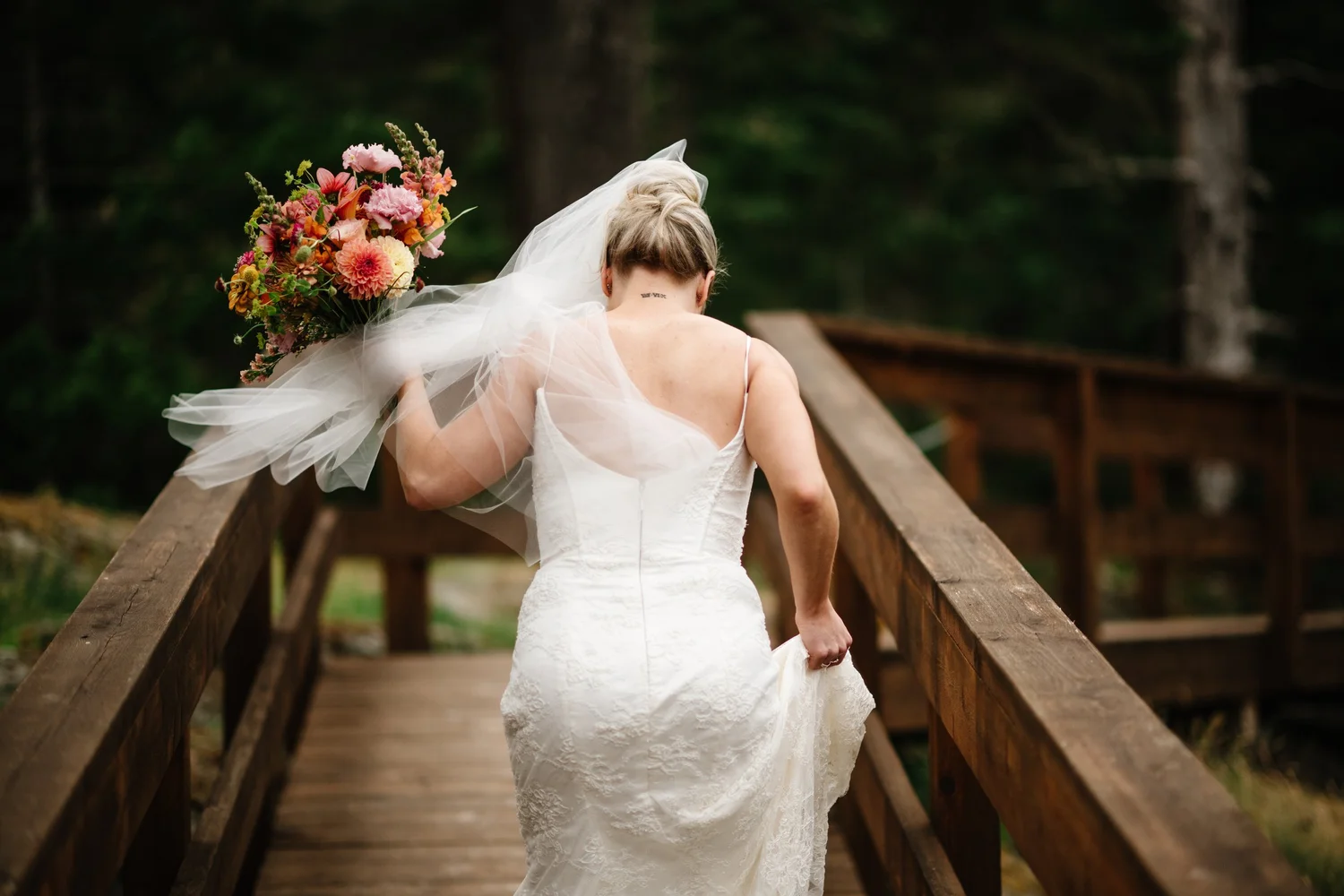 Hailey walking down to the ceremony with her bouquet