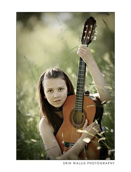 Mariah Guitar and Grass mariah in the grass with her guitar