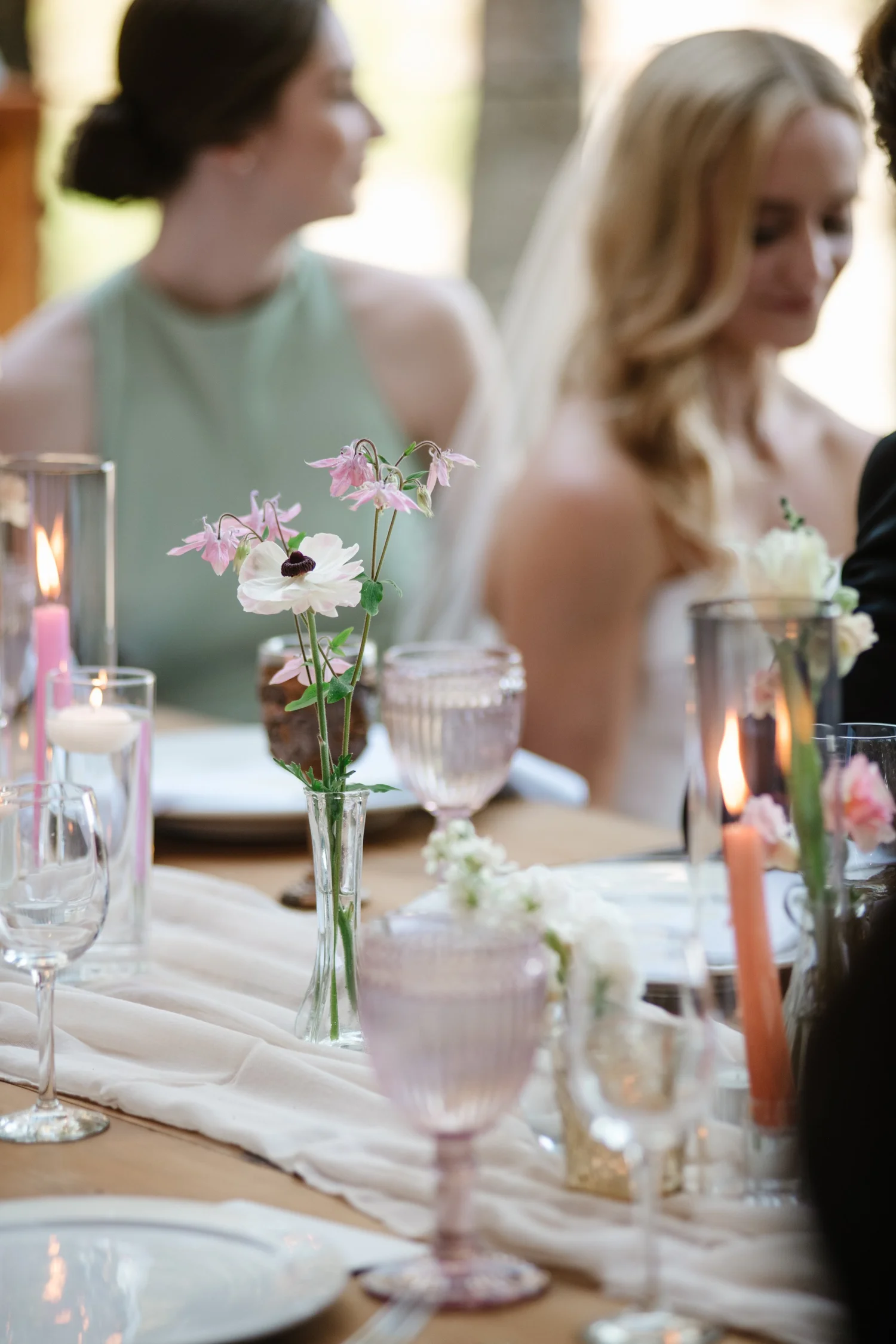 Candles and flowers on the table as dinner begins