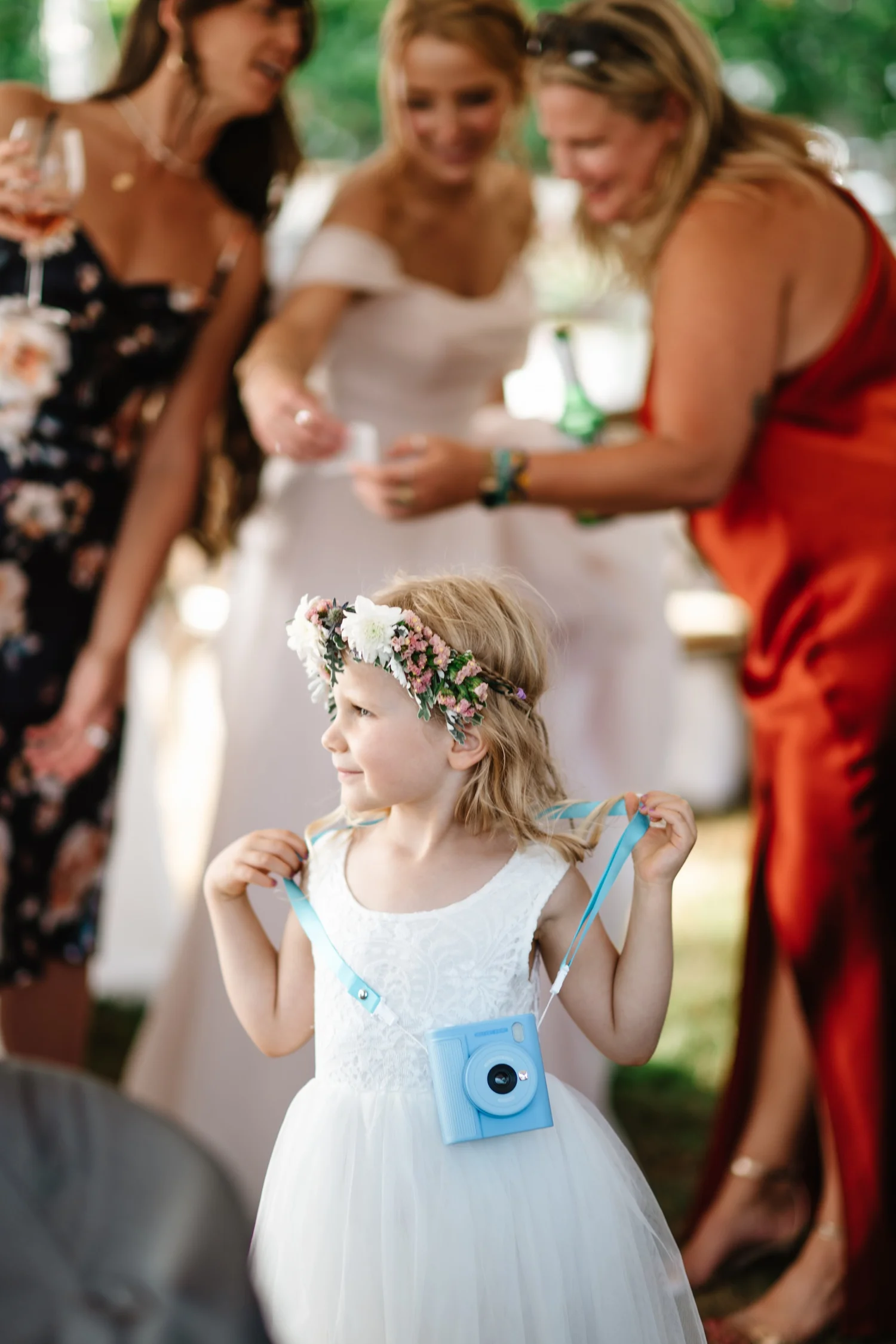 A flower girl getting ready with the women in Charlie’s life